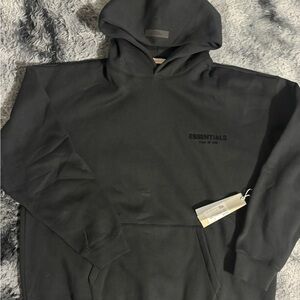 Essentials Black Pullover Hoodie with Subtle Chest Logo